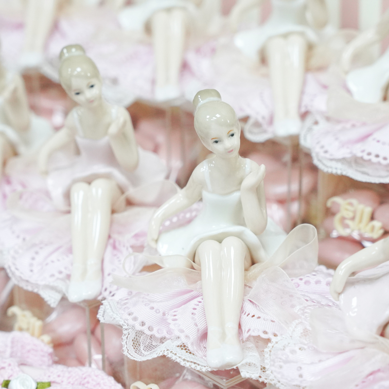 Ballerina baby girl chocolate stand arrangement with personalized backdrop.