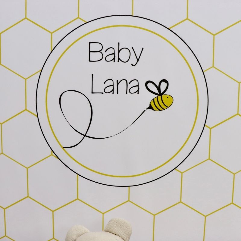 Baby bee theme personalized chocolate wood stand with personalized backdrop.