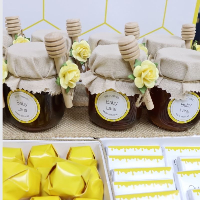 Baby bee theme personalized chocolate wood stand with personalized backdrop.
