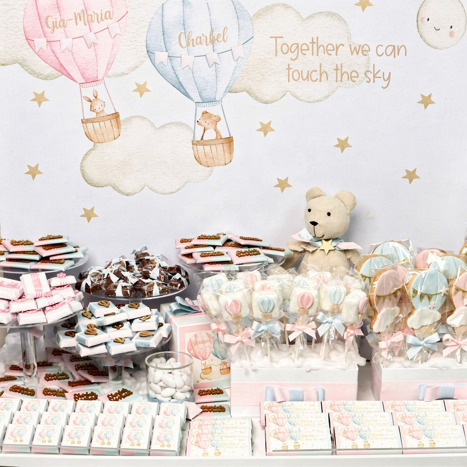 Baby twin designed air balloon theme chocolate arrangement stand with personalized backdrop.