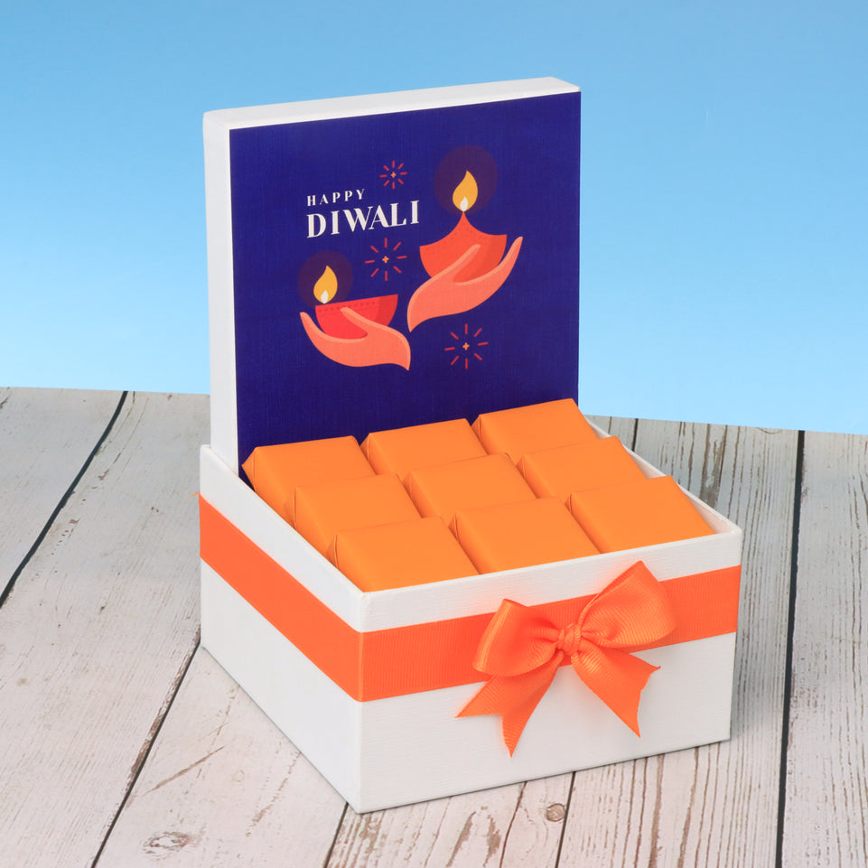 Happy diwali holding hand blue designed premium chocolate small hamper