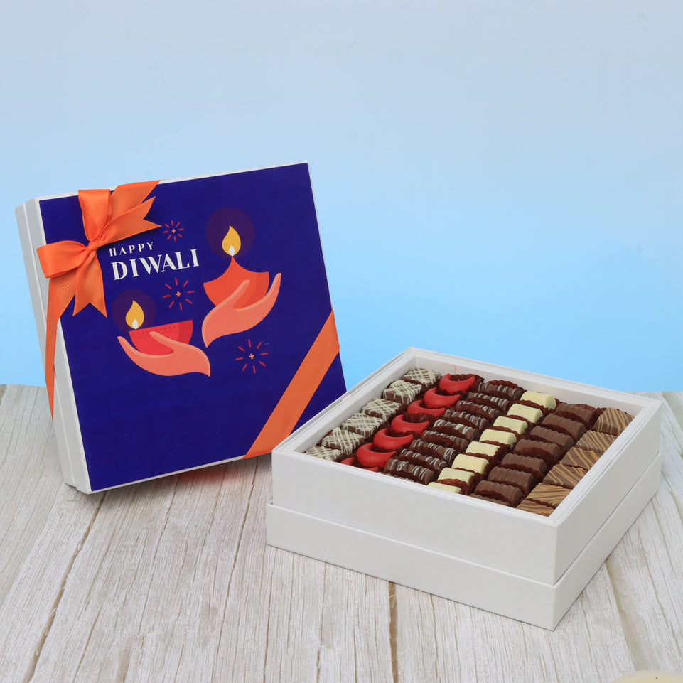 Happy diwali hands holding candle designed premium chocolate hard box