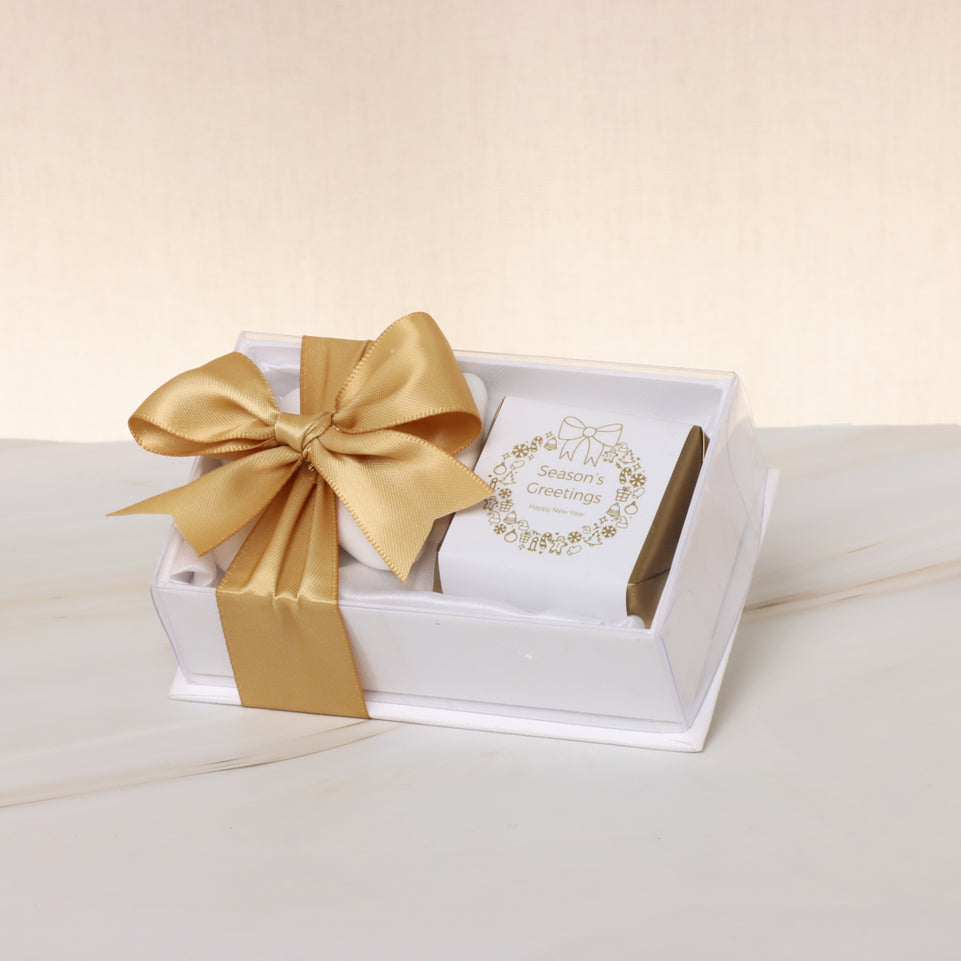 Season's greetings wreath designed chocolate & almond dragees view top box