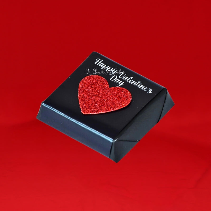 Happy valentines glittery heart decorated chocolate