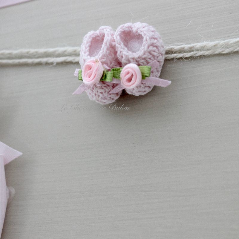 Baby rustic theme crochet decorated chocolate wood stand with customized backdrop.