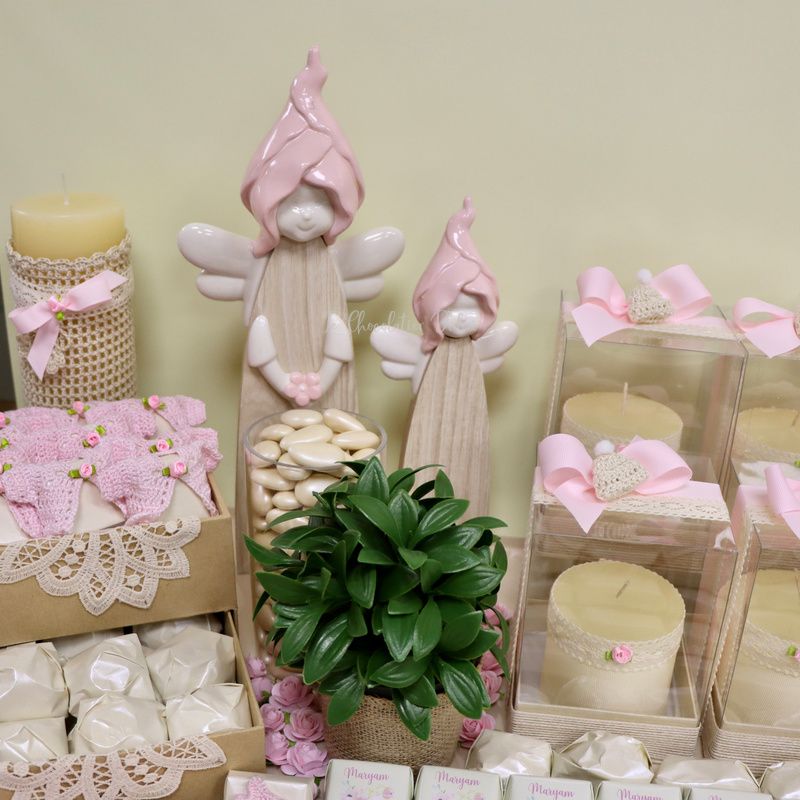 Baby crochet decorated and personalized chocolate wood stand with personalized backdrop.