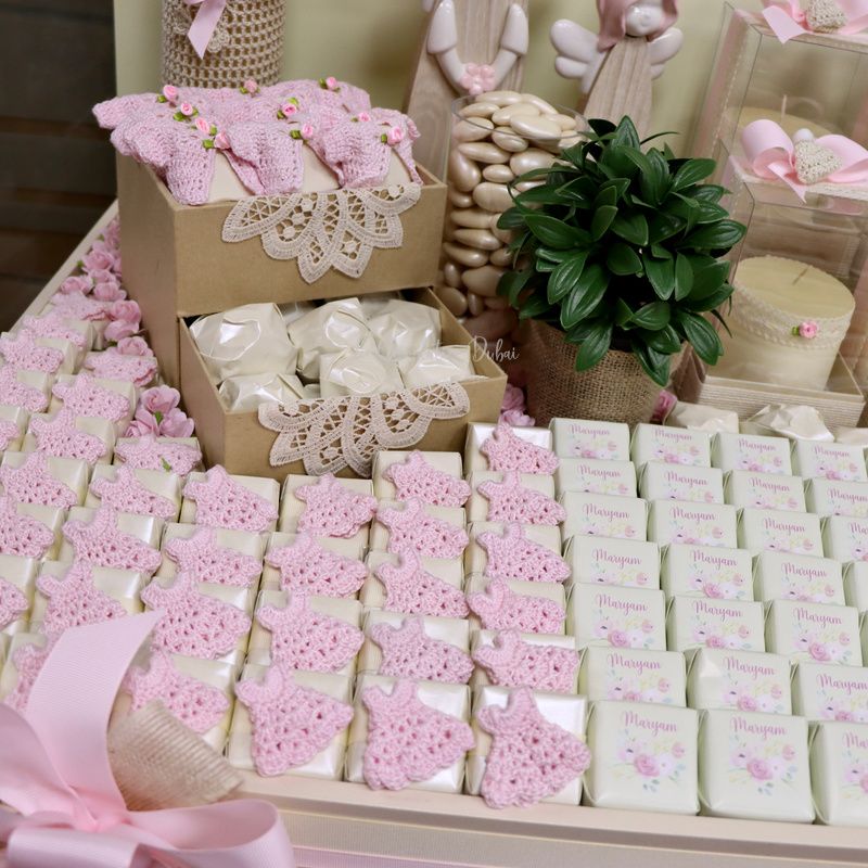 Baby crochet decorated and personalized chocolate wood stand with personalized backdrop.