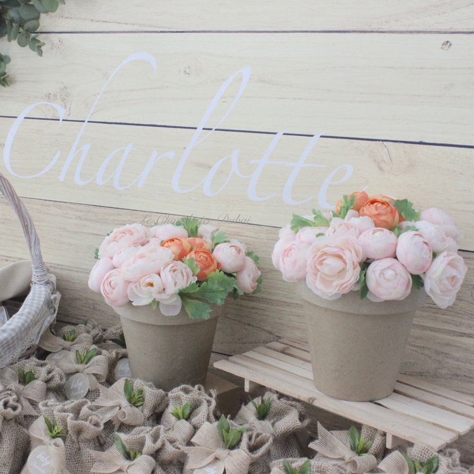 Baby girl rustic floral chocolate wood stand with personalized backdrop.