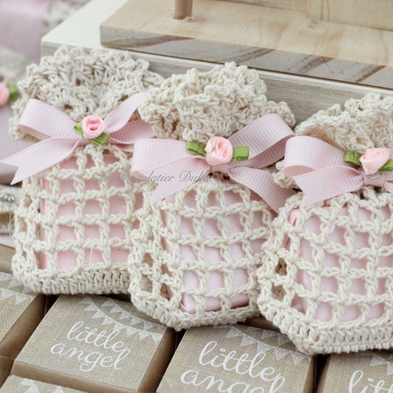 Baby rustic theme crochet decorated chocolate wood stand with customized backdrop.