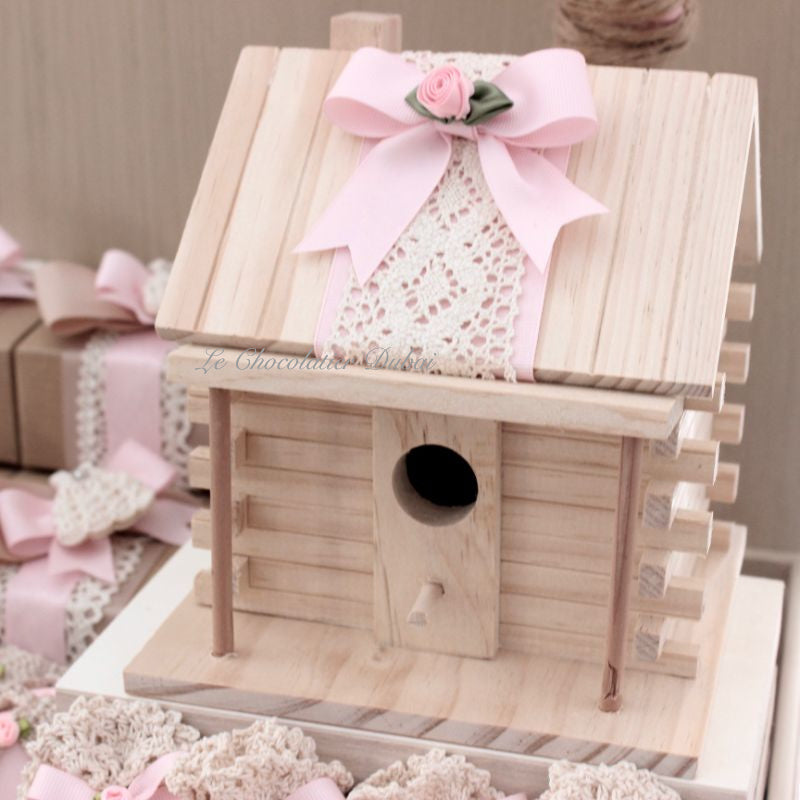 Baby rustic theme crochet decorated chocolate wood stand with customized backdrop.