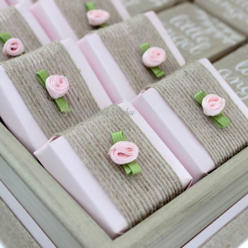 Baby rustic theme crochet decorated chocolate wood stand with customized backdrop.