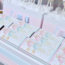 Baby twin designed air balloon theme chocolate arrangement stand with personalized backdrop.