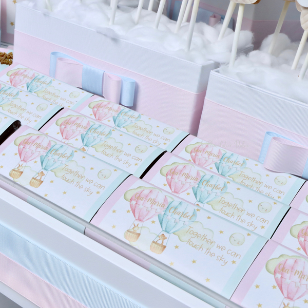 Baby twin designed air balloon theme chocolate arrangement stand with personalized backdrop.