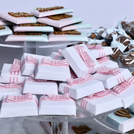 Baby twin designed air balloon theme chocolate arrangement stand with personalized backdrop.