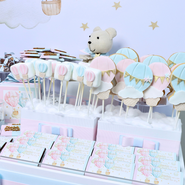 Baby twin designed air balloon theme chocolate arrangement stand with personalized backdrop.