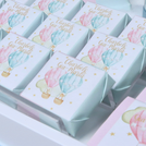 Baby twin designed air balloon theme chocolate arrangement stand with personalized backdrop.