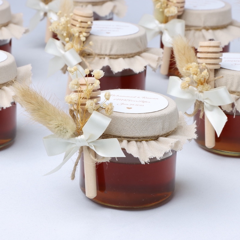 Rustic wedding decorated honey jar