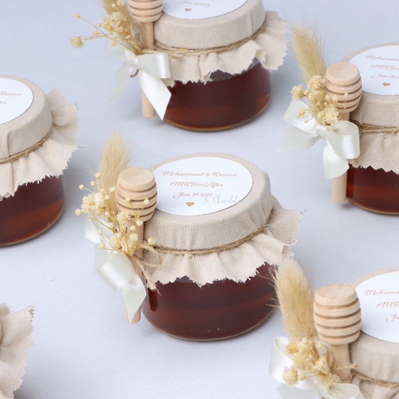 Rustic wedding decorated honey jar