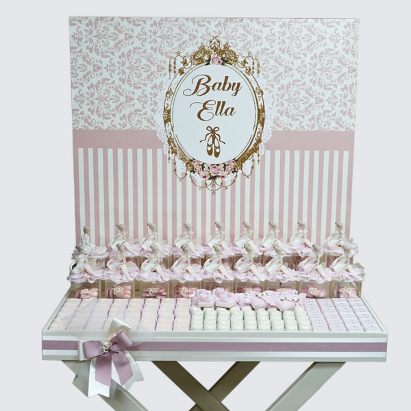 Ballerina baby girl chocolate stand arrangement with personalized backdrop.