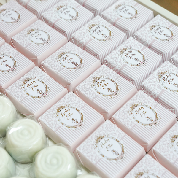 Ballerina baby girl chocolate stand arrangement with personalized backdrop.