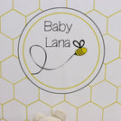 Baby bee theme personalized chocolate wood stand with personalized backdrop.