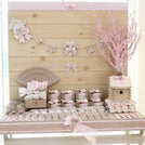 Baby rustic theme crochet decorated chocolate wood stand with customized backdrop.