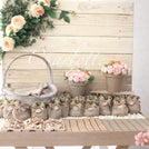 Baby girl rustic floral chocolate wood stand with personalized backdrop.