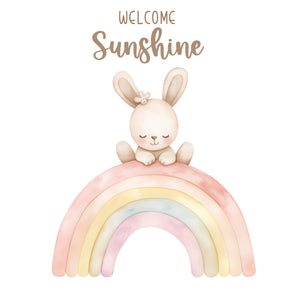 Baby girl bunny sitting on rainbow we...