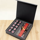 Corporate branded premium chocolate magnetic printed hard box with matching ribbon.