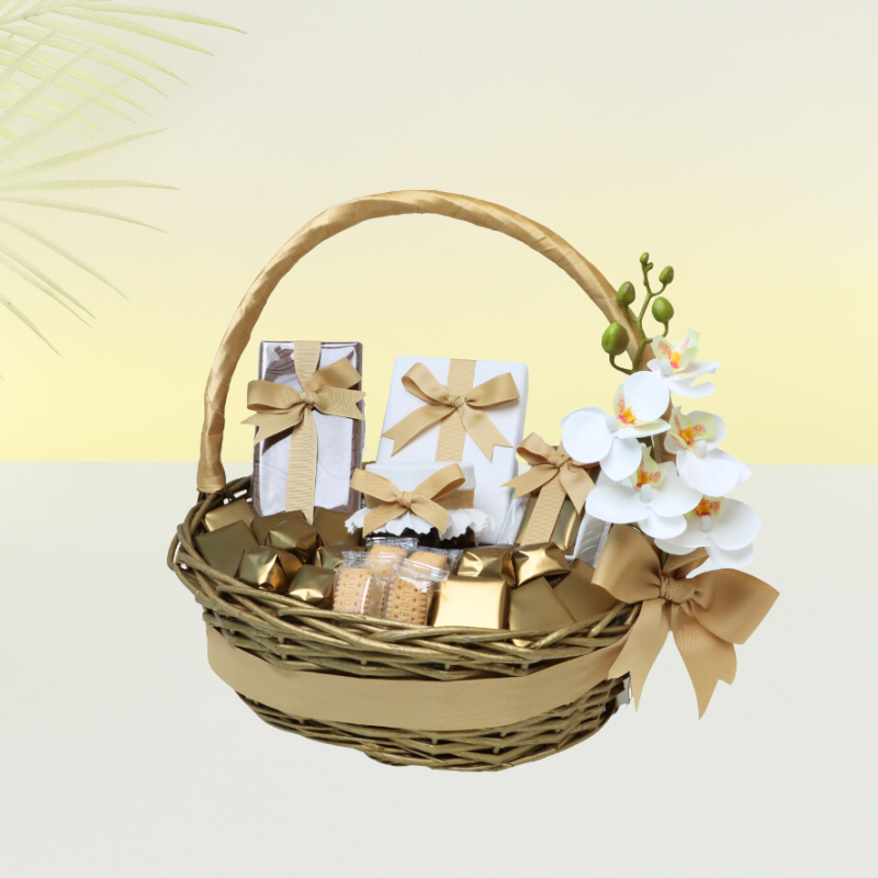 Flower decorated chocolate and delights and honey jar basket