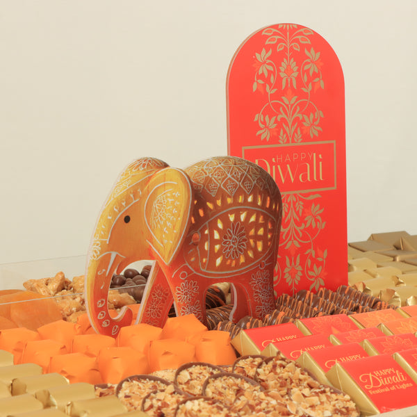 Happy Diwali with acrylic elephant decorated chocolate & sweets medium leather tray