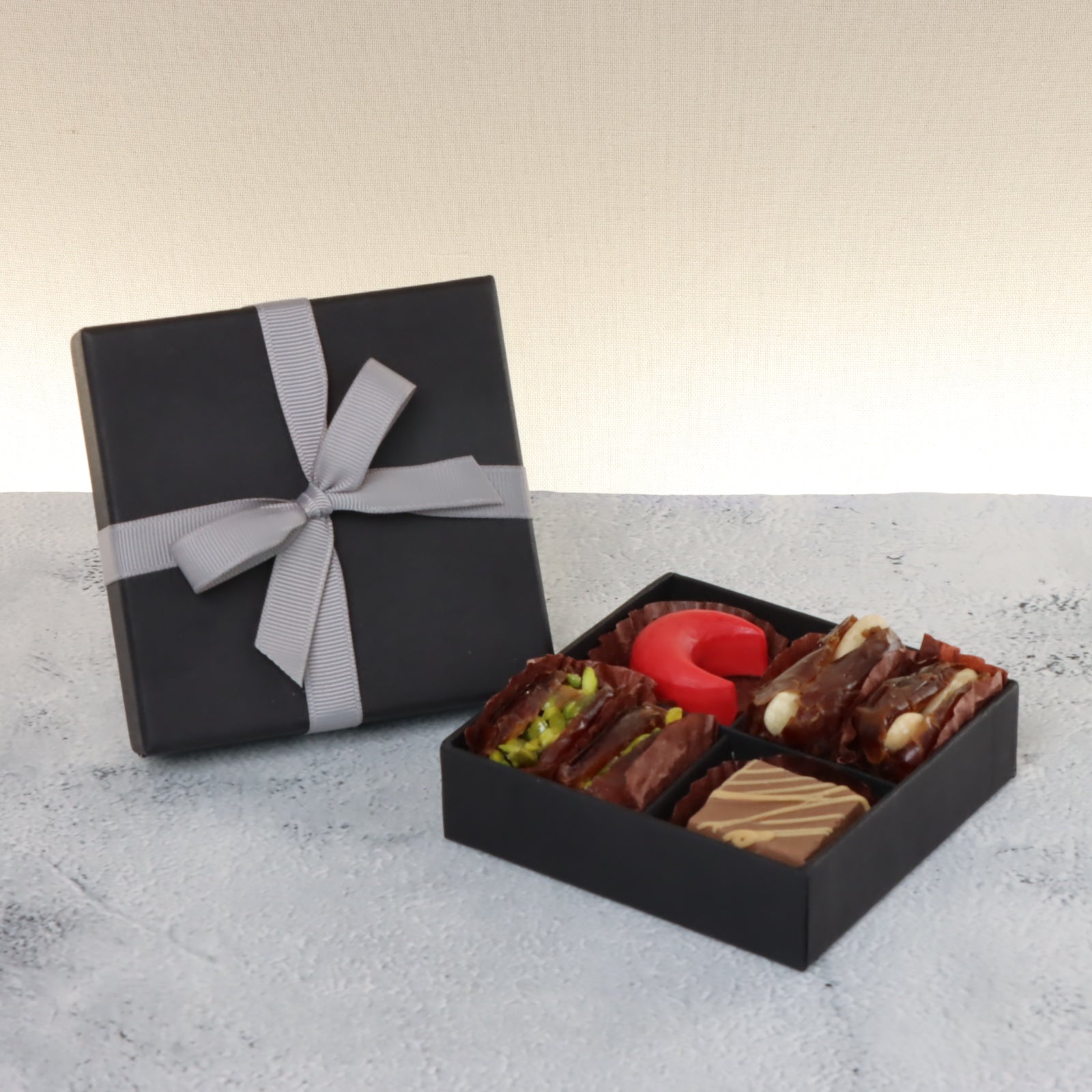 Set of 15 Premium chocolate & dates 4pc black hard box with silver ribbon