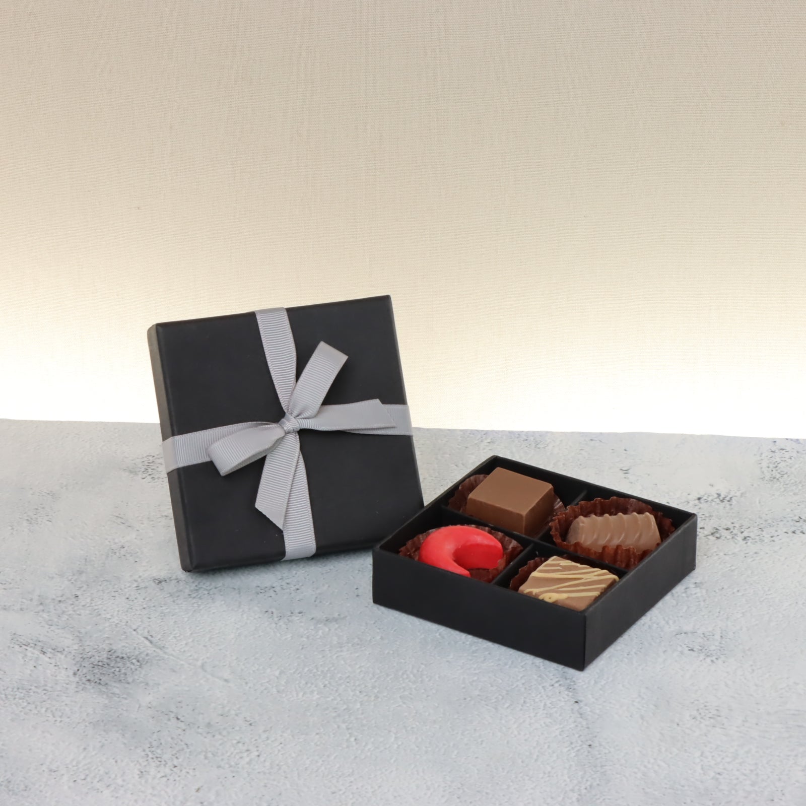 Set of 15 Premium chocolate 4-pc black hard box with silver ribbon
