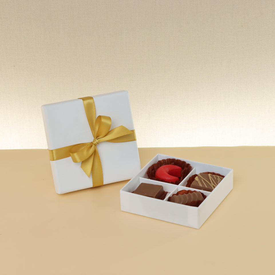 Premium chocolate 4-pc white hard box with gold ribbon