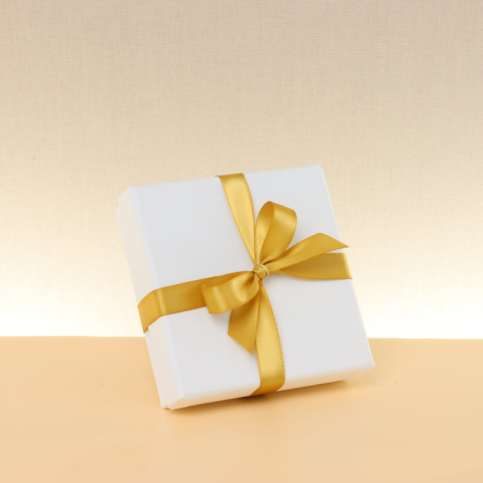 Premium chocolate 4-pc white hard box with gold ribbon