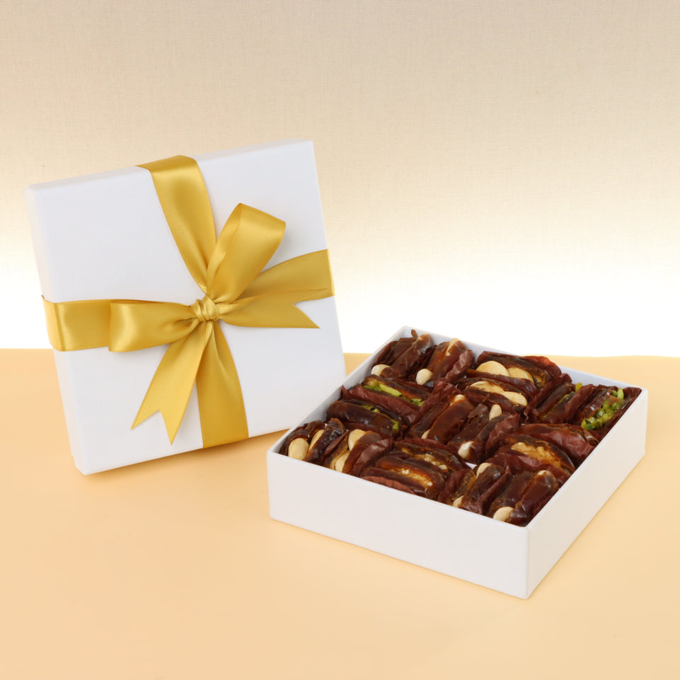 Premium nut stuffed dates 9-pc hard box with gold ribbon