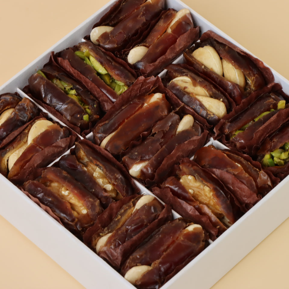 Premium nut stuffed dates 9-pc hard box with gold ribbon