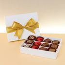 Premium chocolate 12-pc white hard box with gold ribbon