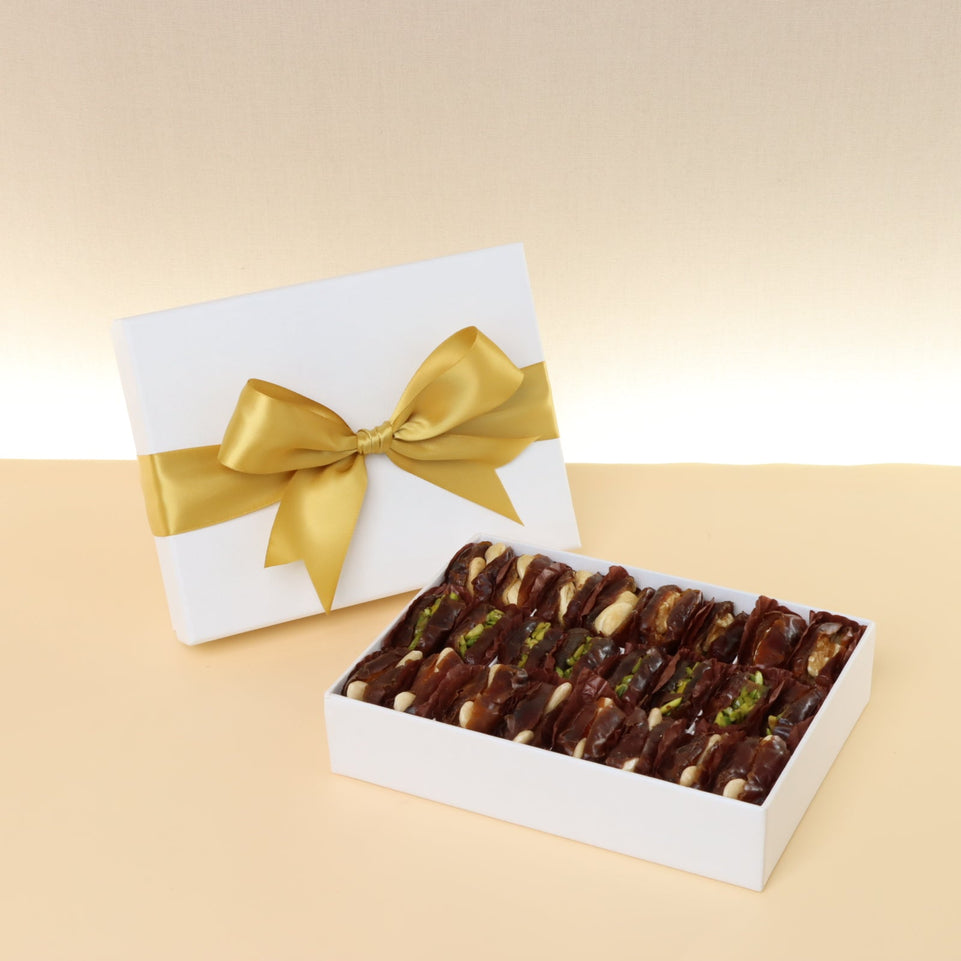 Premium nut stuffed dates 12-pc hard box with gold ribbon