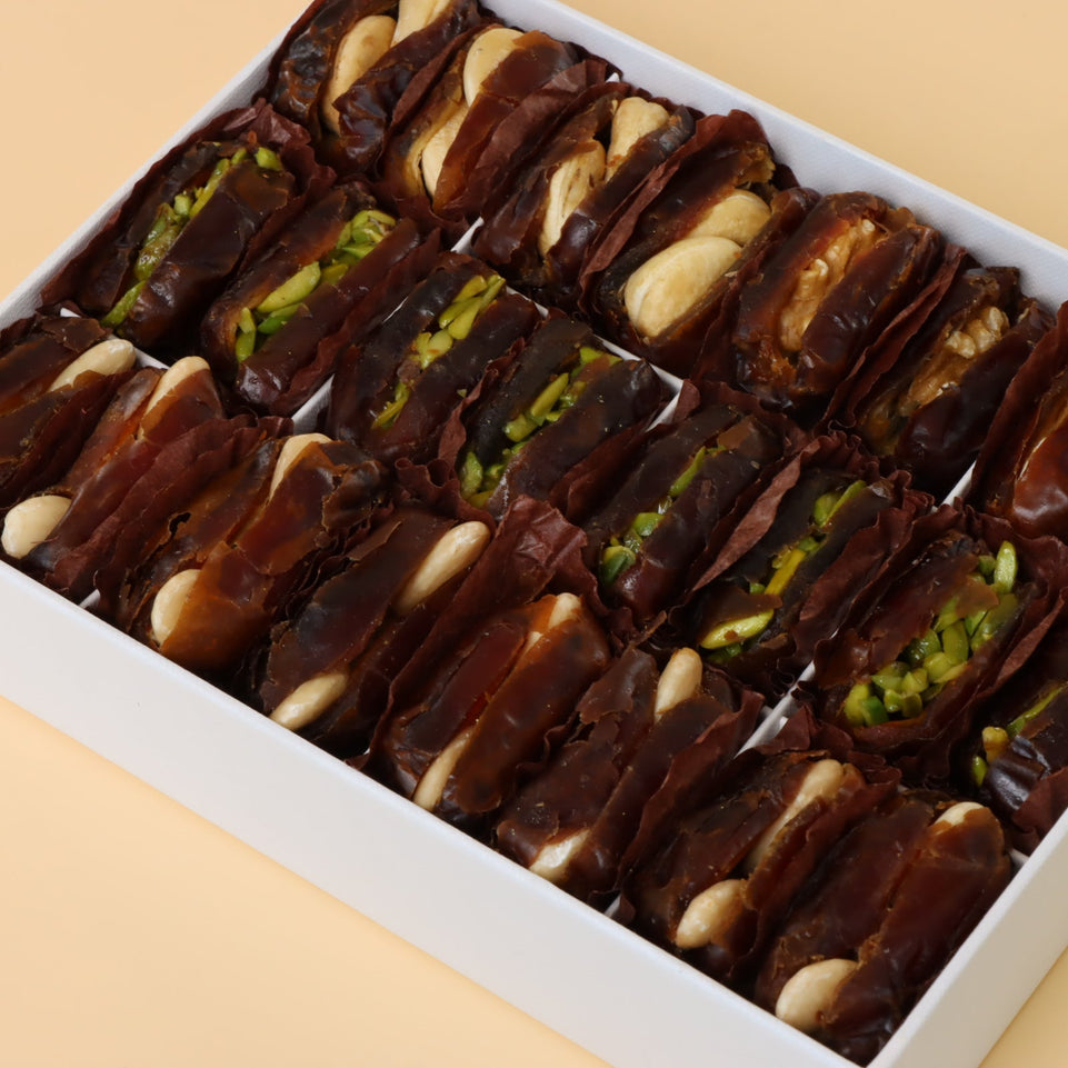 Premium nut stuffed dates 12-pc hard box with gold ribbon