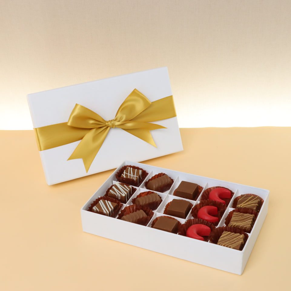 Premium chocolate 15-pc white hard box with gold ribbon