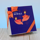 Happy diwali hands holding candle designed premium chocolate hard box
