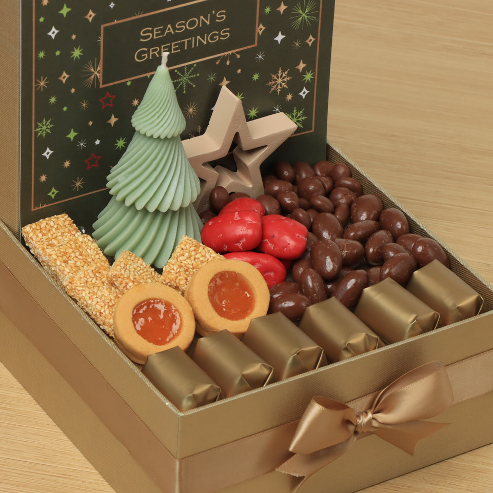 Season's Greeting designed with tree candle and decorated star premium chocolate & sweets medium hamper