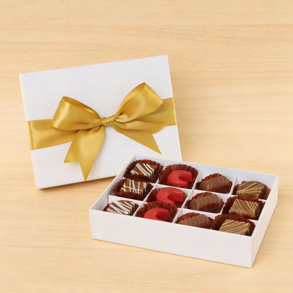Premium chocolate 12-pc white hard box with gold ribbon