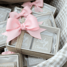 Baby girl rustic floral chocolate wood stand with personalized backdrop.