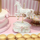 Baby girl carousel theme dessert table