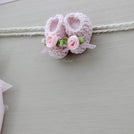 Baby rustic theme crochet decorated chocolate wood stand with customized backdrop.