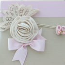 Baby rustic theme crochet decorated chocolate wood stand with customized backdrop.