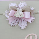 Baby rustic theme crochet decorated chocolate wood stand with customized backdrop.