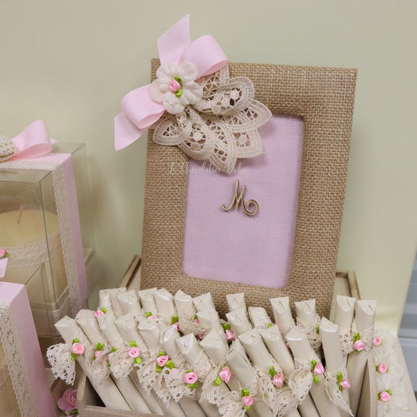 Baby crochet decorated and personalized chocolate wood stand with personalized backdrop.